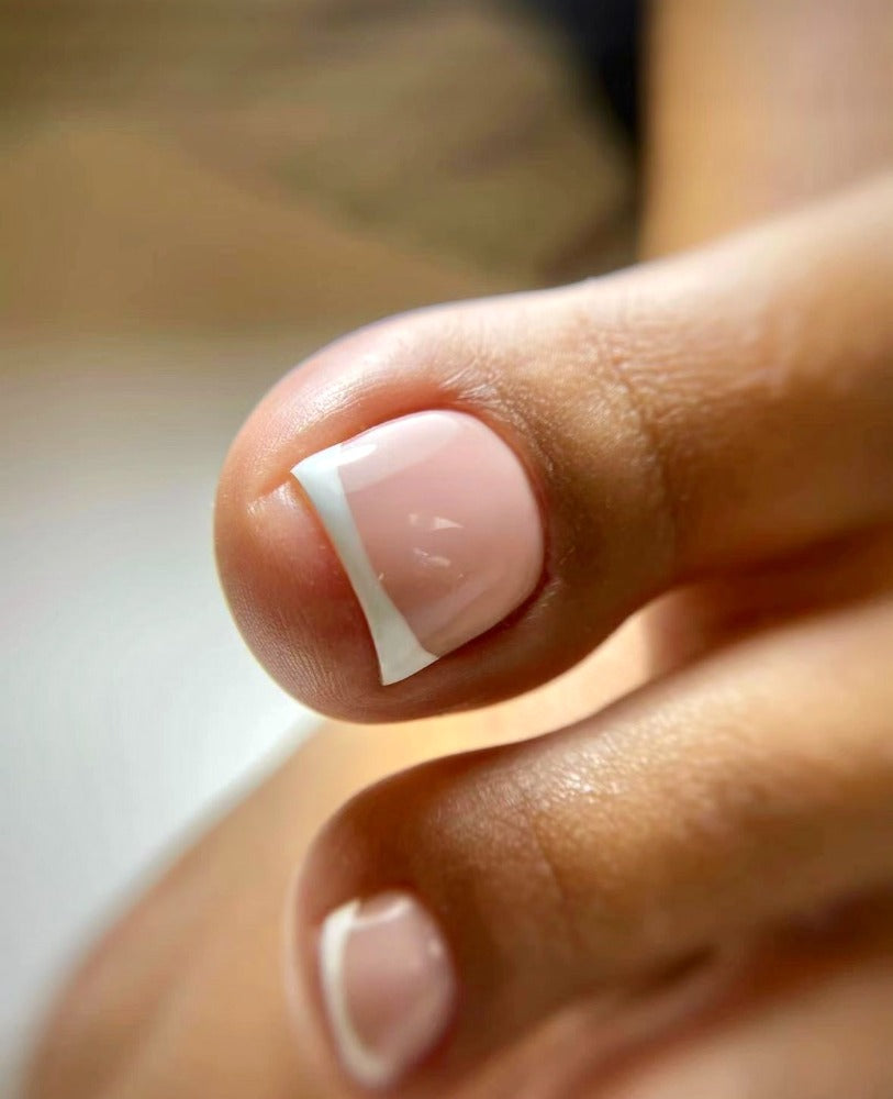 Foto van teennagels met BIAB-laag